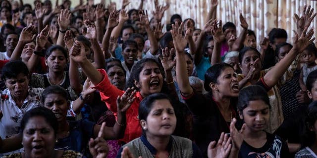Members of Zion Church, which was bombed on Easter Sunday, pray at a community hall in Batticaloa, Sri Lanka, May 5, 2019.