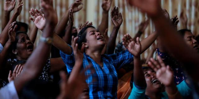 Zion Church members pray at a community hall in Batticaloa, Sri Lanka, May 5, 2019. Their church was bombed on Easter Sunday.