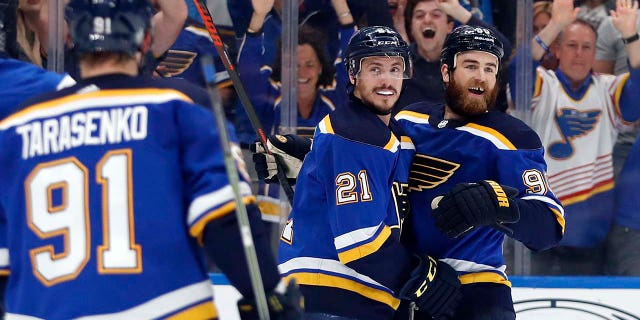 St. Louis Blues center Tyler Bozak (21) celebrates with Vladimir Tarasenko (91), of Russia, and Ryan O'Reilly (90) after Bozak scored a goal against the San Jose Sharks during the first period in Game 4 of the NHL hockey Stanley Cup Western Conference final series Friday, May 17, 2019, in St. Louis.