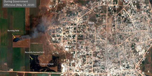 This satellite image provided by Maxar Technologies on Tuesday, May 28, 2019 shows significant damage to Habeet, Syria on May 26 as a result of a government offensive against the last rebel stronghold in the country. The images, provided to the Associated Press by the Colorado-based Maxar Technologies show fire still raging in olive groves and orchards during harvest season around Kfar Nabudah and Habeet, two villages on the edge of Idlib province where fighting has focused.