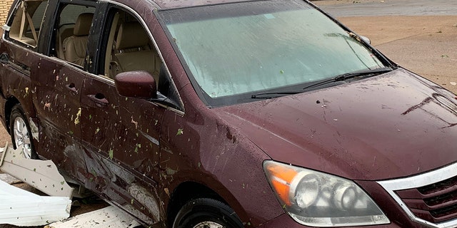 Damage to a vehicle after a tornado ripped through Jefferson City, Mo. late Wednesday.