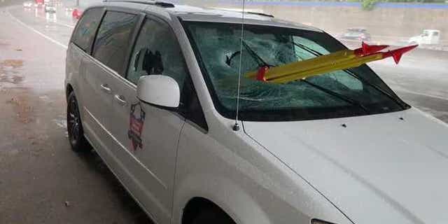 A stolen tripod smashed through the glass of a van last Thursday, injuring the passenger, authorities said.