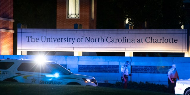 Police secure the main entrance to UNC Charlotte after a shooting at the school that left two students dead, Tuesday, April 30, 2019, in Charlotte, N.C.