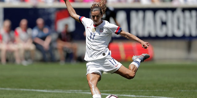 Tobin Heath shooting a scoring shot against Mexico during the first half of the match. (AP Photo/Julio Cortez)