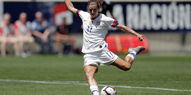 Tobin Heath shooting a scoring shot against Mexico during the first half of the match. (AP Photo/Julio Cortez)