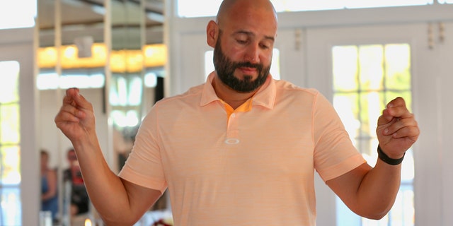 Saunderson, pictured above, "basically came in and was just at the bar trying to get drinks then he was dancing with the bridesmaids and the groom's mother."