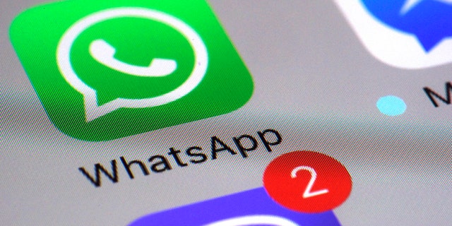 FILE - This Friday, March 10, 2017, file photo shows the WhatsApp communications app on a smartphone, in New York. WhatsApp says a vulnerability in the popular communications app let mobile phones be infected with sophisticated spyware with a missed in-app call alone. (AP Photo/Patrick Sison, File)