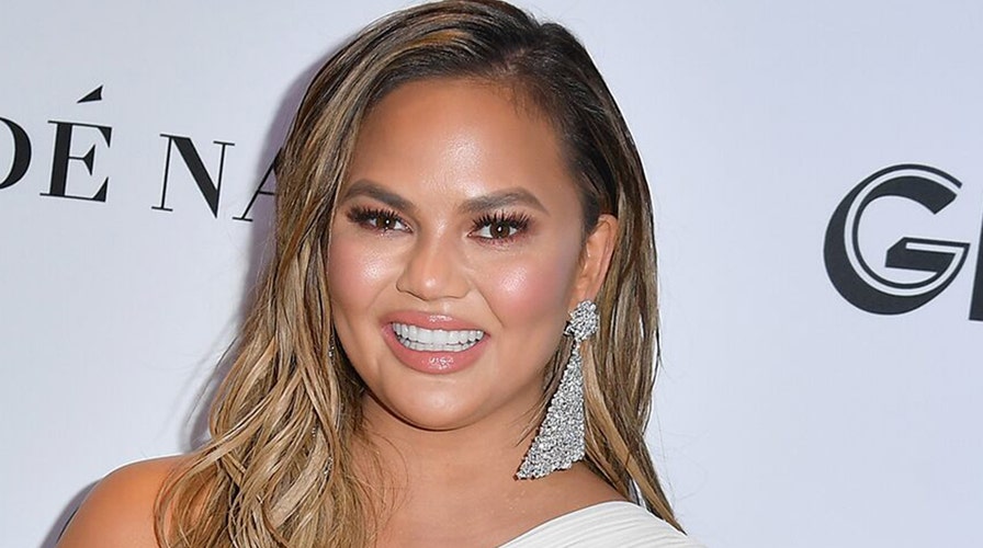 Chrissy Teigen shares pregnant topless photo