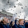 United States Air Force Academy cadets toss their hats in the air as the Thunderbirds fly overhead during the cadets' graduation ceremony at Falcon Stadium in Colorado Springs, Colorado, May 30, 2019. 