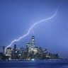 Lightning strikes on either side of One World Trade Center in New York City, May 28, 2019.