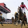 Jockey Tyler Gaffalione rides War of Will across the finish line to win the Preakness Stakes horse race at Pimlico Race Course, in Baltimore, May 18, 2019.