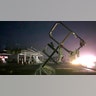 A destroyed sign for a car wash is seen in tornado-hit Jefferson City, Mo., Thursday. The heavily damaged gas station is at the background. (AP Photo/David A. Lieb)