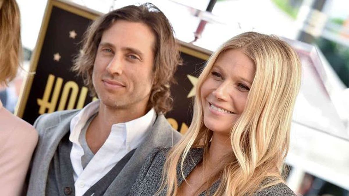 Actress Charlize Theron referenced Gwyneth Paltrow, right, and husband Brad Falchuk's past arrangement of living in separate homes as an approach she would take in her next relationship.