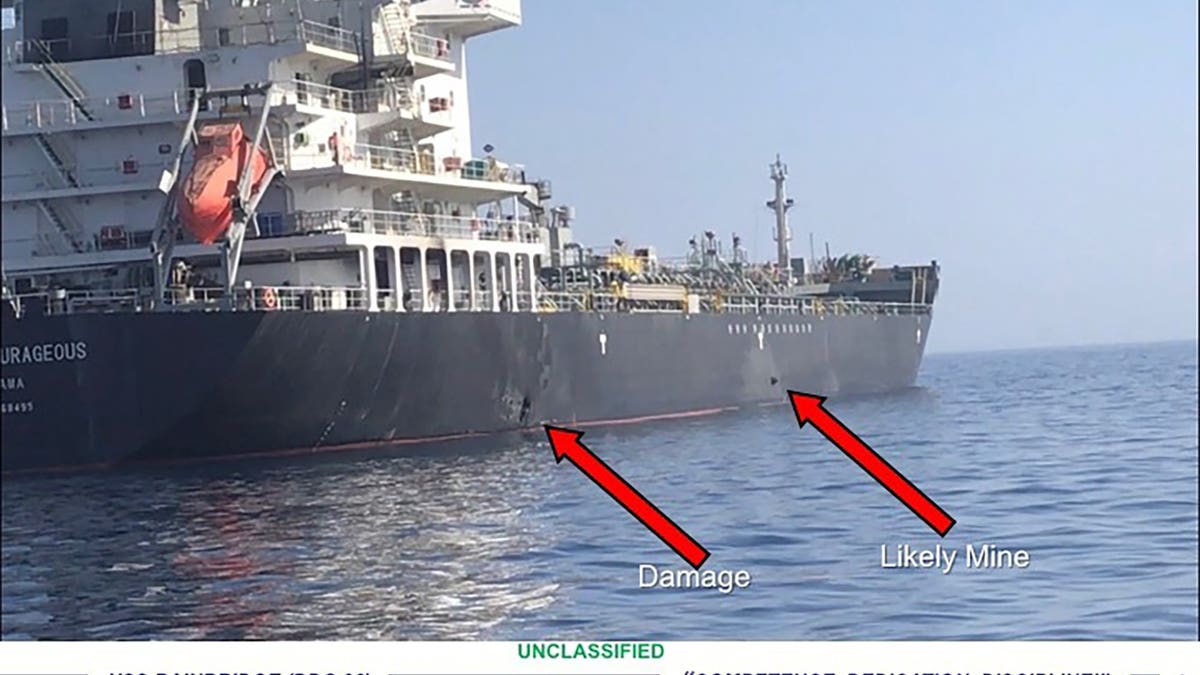 This June 13, 2019, image released by the U.S. military's Central Command, shows damage and a suspected mine on the Kokuka Courageous in the Gulf of Oman near the coast of Iran. The U.S. military on Friday, June 14, 2019, released a video it said showed Iran's Revolutionary Guard removing an unexploded limpet mine from one of the oil tankers targeted near the Strait of Hormuz, suggesting the Islamic Republic sought to remove evidence of its involvement from the scene.