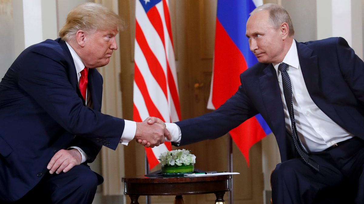 In this July 16, 2018, file photo, U.S. President Donald Trump, left, and Russian President Vladimir Putin shake hands at the beginning of a meeting at the Presidential Palace in Helsinki, Finland. (AP Photo/Pablo Martinez Monsivais)