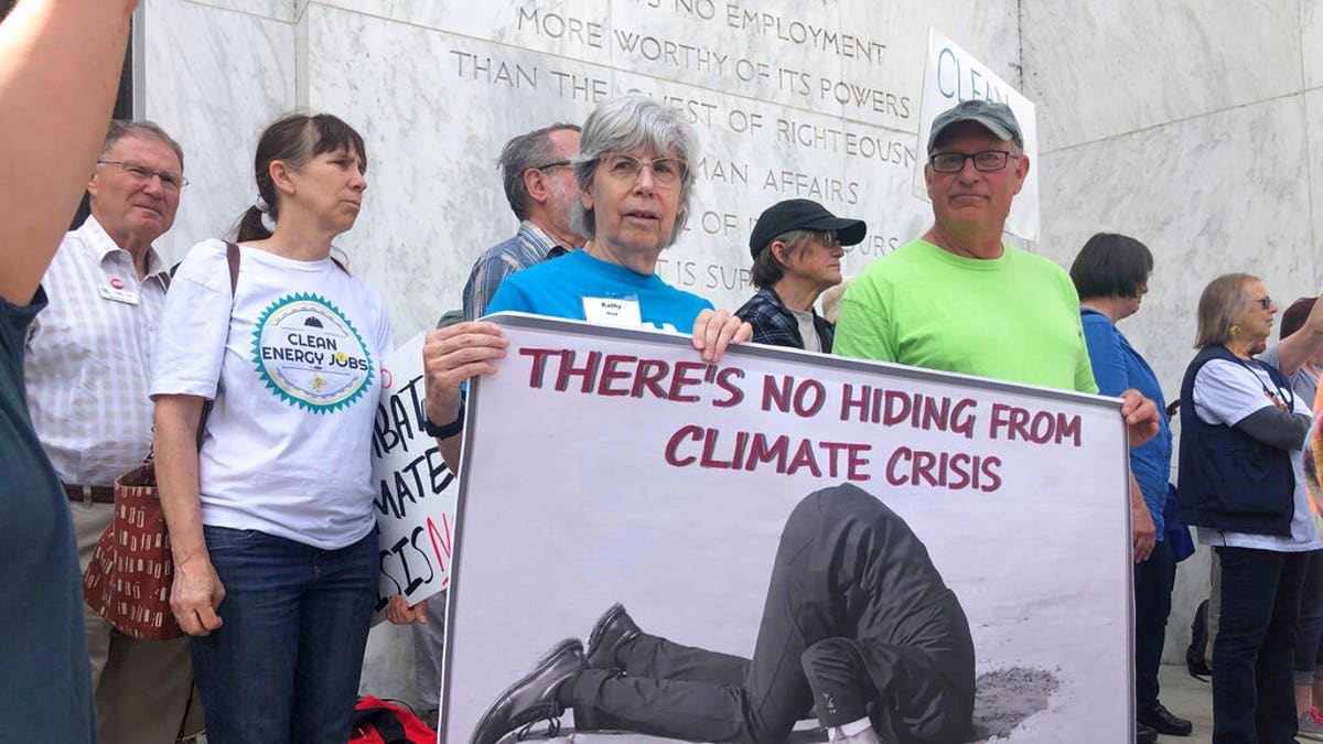 Protesters flood the steps of the Oregon State Capitol Tuesday, June 25, 2019, to push back against a Republican walkout over a climate change bill that has entered its sixth day in Salem, Ore. (AP Photo/Sarah Zimmerman)