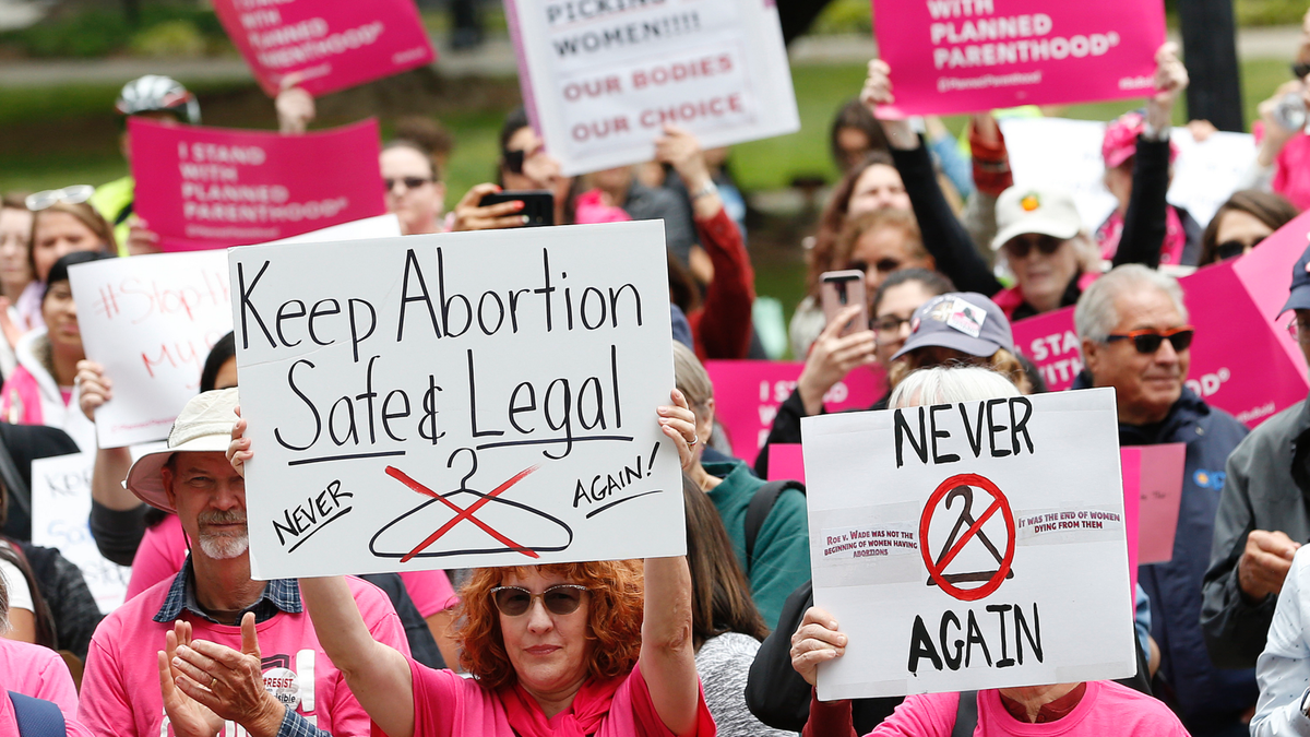 FILE - In this May 21, 2019, file photo, People gather at the state Capitol to rally in support of abortion rights in Sacramento, Calif. The Trump administration has agreed to postpone implementing a rule allowing medical workers to decline performing abortions or other treatments on moral or religious grounds while the so-called 