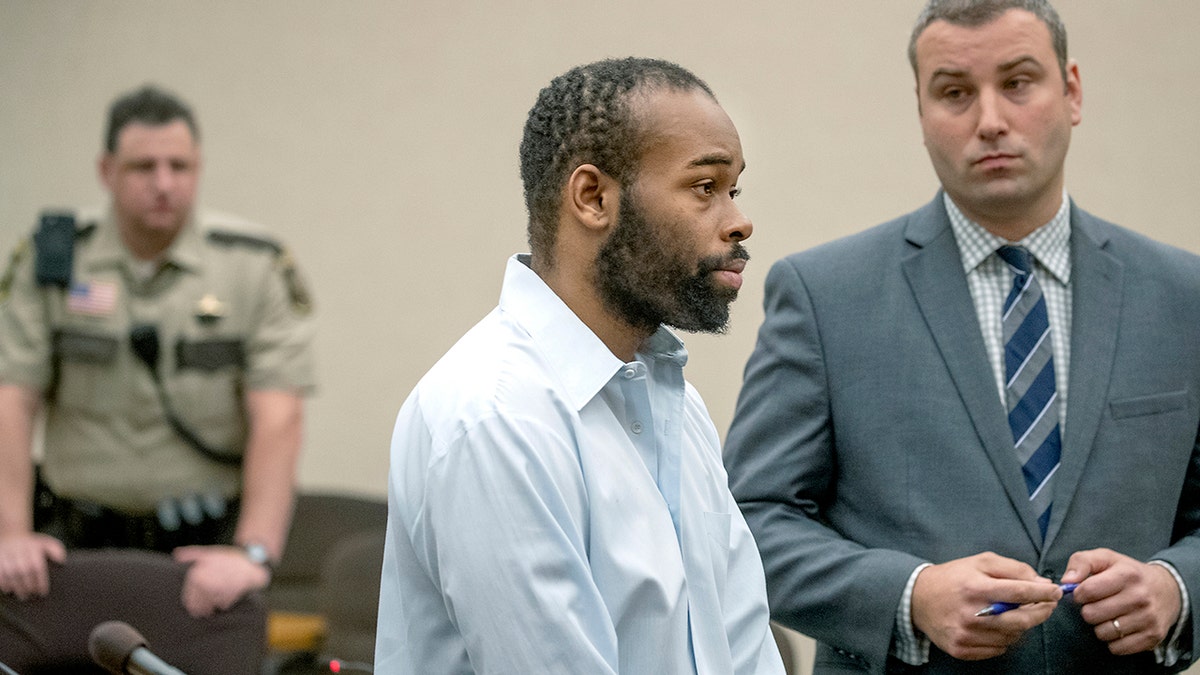 Emmanuel Aranda, who threw a 5-year-old boy over a Mall of America balcony, and his lawyer Paul Sellers, right, listen as Judge Jeannice Reding hands out a 19-year sentence at the Hennepin County Government Center, Monday, in Minneapolis. (Elizabeth Flores/Star Tribune via AP)