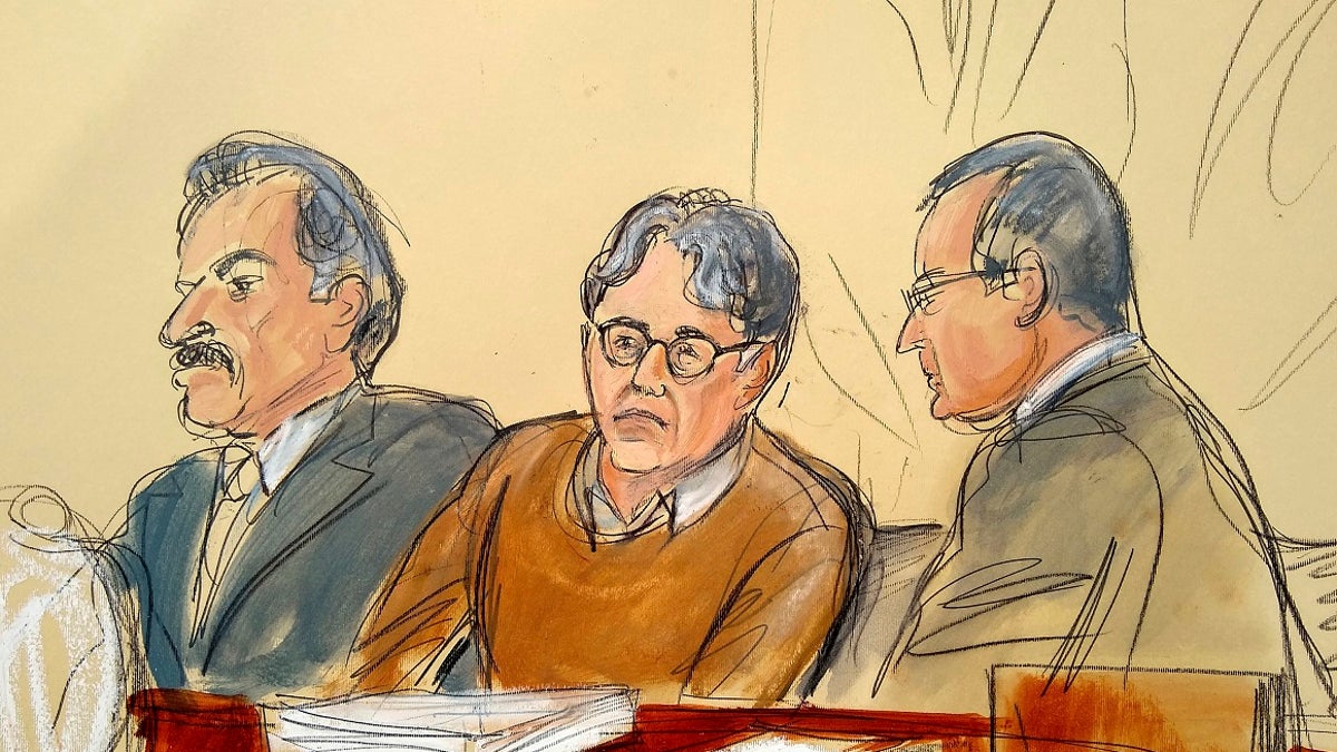 In this Tuesday, May 7, 2019 file courtroom drawing, defendant Keith Raniere, center, leader of the secretive group NXIVM, is seated between his attorneys Paul DerOhannesian, left, and Marc Agnifilo during the first day of his sex trafficking trial. (Elizabeth Williams via AP, File)