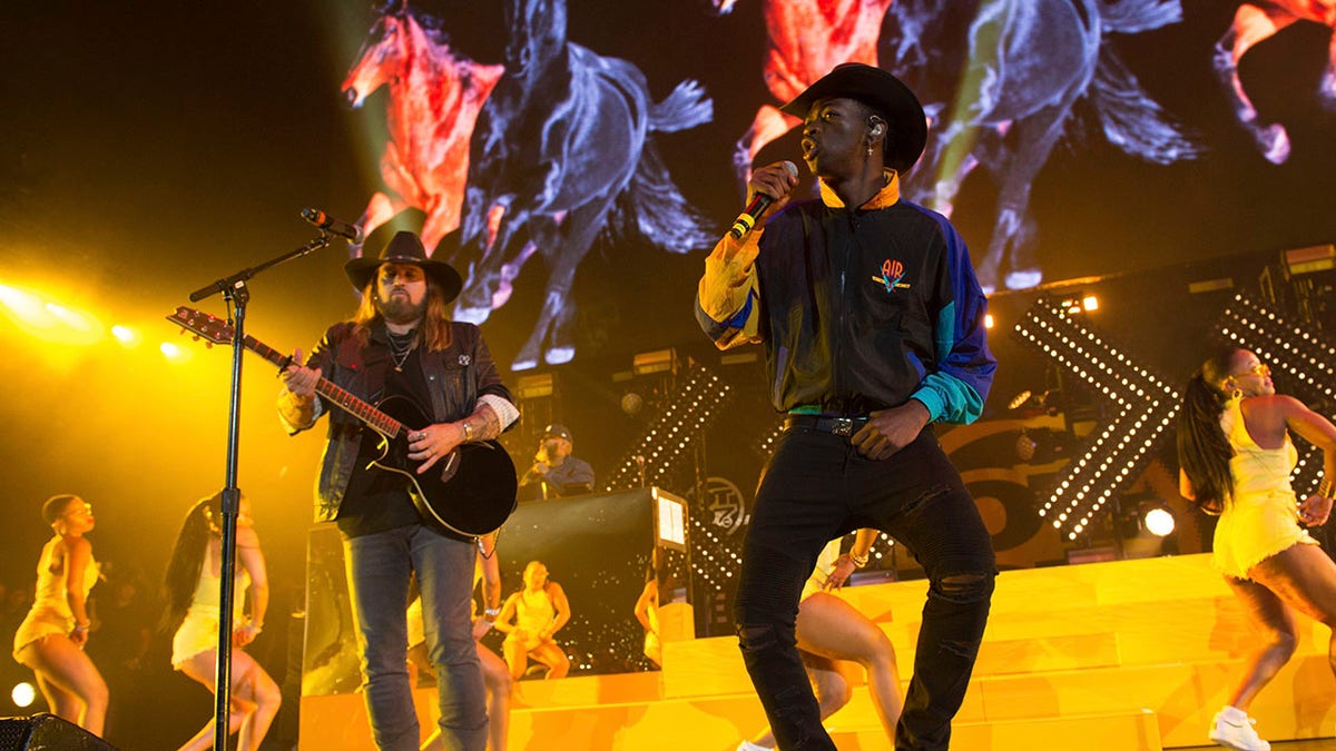 Billy Ray Cyrus, left, and Lil Nas X perform at HOT 97 Summer Jam 2019 at MetLife Stadium on Sunday, June 2, 2019, in East Rutherford, N.J. (Associated Press)