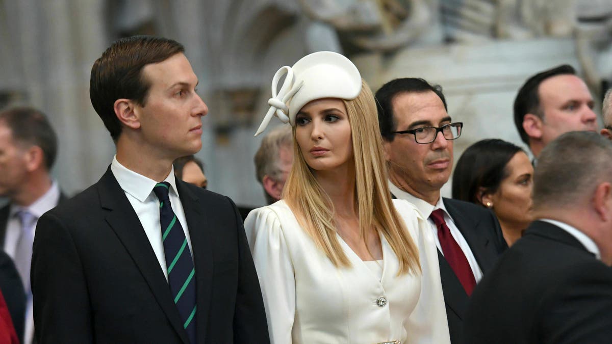 Ivanka Trump and Jared Kushner look on as U.S President Donald Trump places a wreath on the Grave of the Unknown Warrior during a tour of Westminster Abbey in central London. (Stefan Rousseau/Pool Photo via AP)