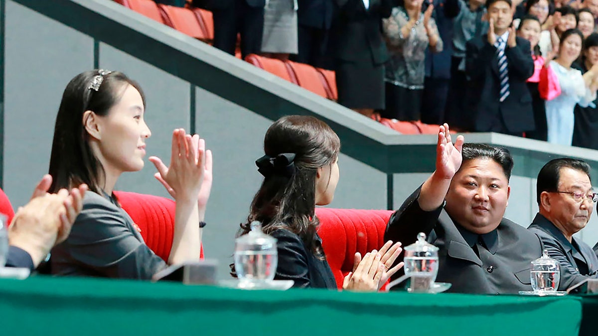 The woman next to Ri Sol Ju (center) appears to be Kim Jong Un's sister, Kim Yo Jong (left), who state media said attended the performance. 