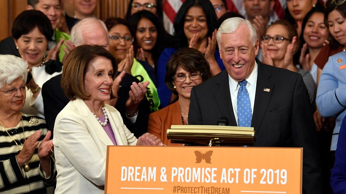 House Speaker Nancy Pelosi of Calif., front left, shakes hands with House Majority Leader Steny Hoyer, D-Md., during an event to support the American Dream and Promise Act. (AP Photo/Susan Walsh)