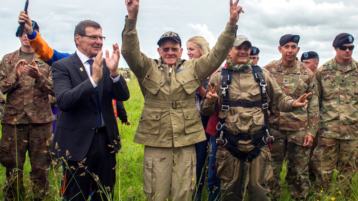 D-Day veteran Tom Rice celebrating after parachuting in the tandem jump.