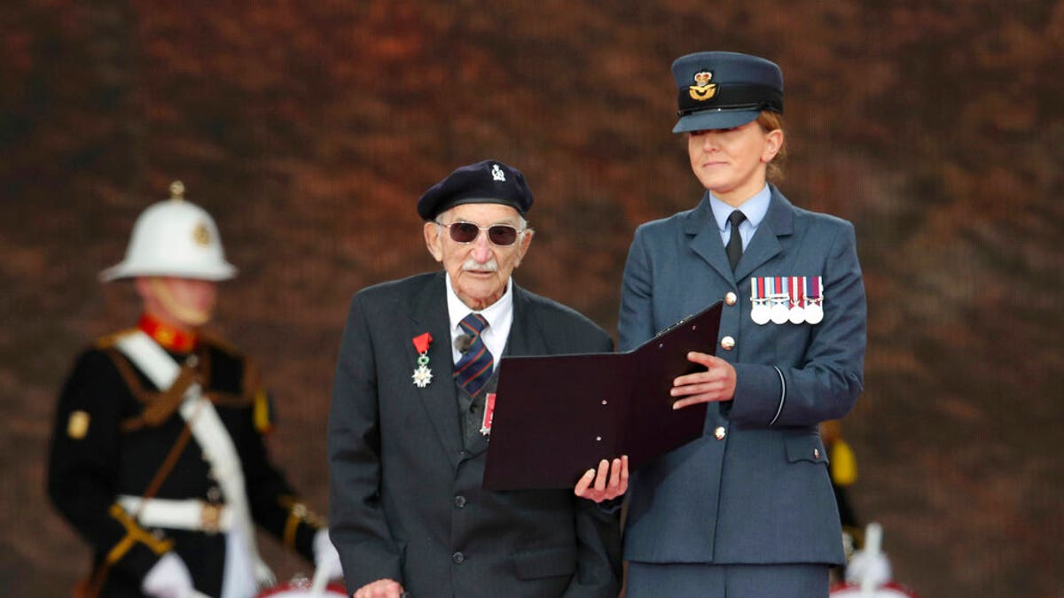 D-Day veteran John Jenkins on stage during commemorations for the 75th Anniversary of the D-Day landings, in Portsmouth, England, Wednesday June 5, 2019.