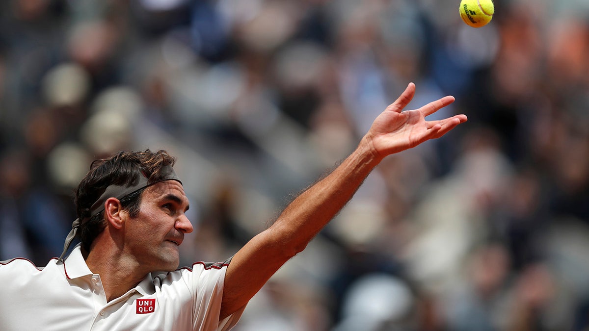 Switzerland's Roger Federer serves against Spain's Rafael Nadal during their semifinal match of the French Open tennis tournament at the Roland Garros stadium in Paris, Friday, June 7, 2019. (AP Photo/Christophe Ena)