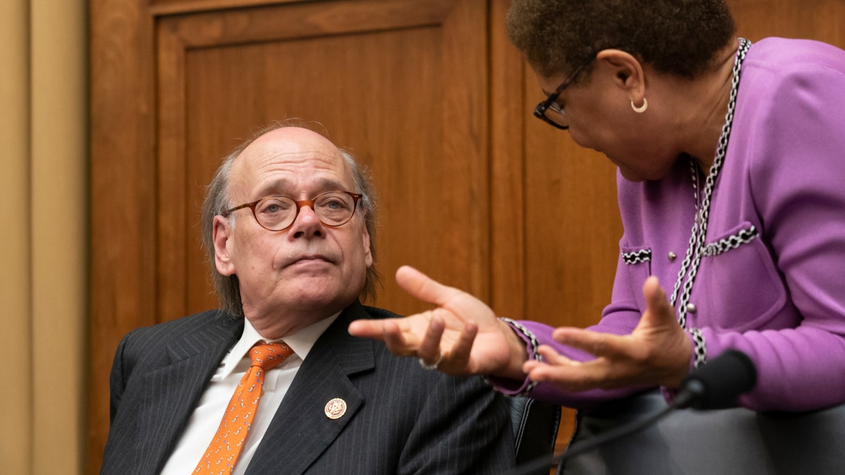 House Judiciary Committee members Rep. Steve Cohen, D-Tenn., left, listens to Rep. Karen Bass, D-Calif., as House Democrats start a hearing to examine whether President Donald Trump obstructed justice, the first of several hearings scheduled by Democrats on special counsel Robert Mueller's report, on Capitol Hill in Washington, Monday, June 10, 2019. (AP Photo/J. Scott Applewhite)