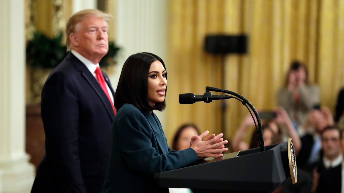 President Donald Trump listens to Kim Kardashian West, who is among the celebrities who have advocated for criminal justice reform, speak during an event on second chance hiring in the East Room of the White House, Thursday, June 13, 2019, in Washington.