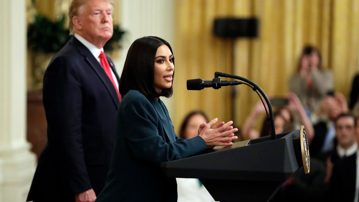 President Donald Trump listens to Kim Kardashian West, who is among the celebrities who have advocated for criminal justice reform, speak during an event on second chance hiring in the East Room of the White House, Thursday, June 13, 2019, in Washington.