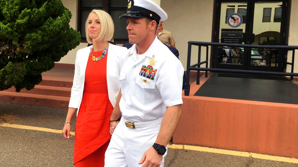 FILE: Navy Special Operations Chief Edward Gallagher leaves a military courtroom on Naval Base San Diego with his wife, Andrea Gallagher, in San Diego.