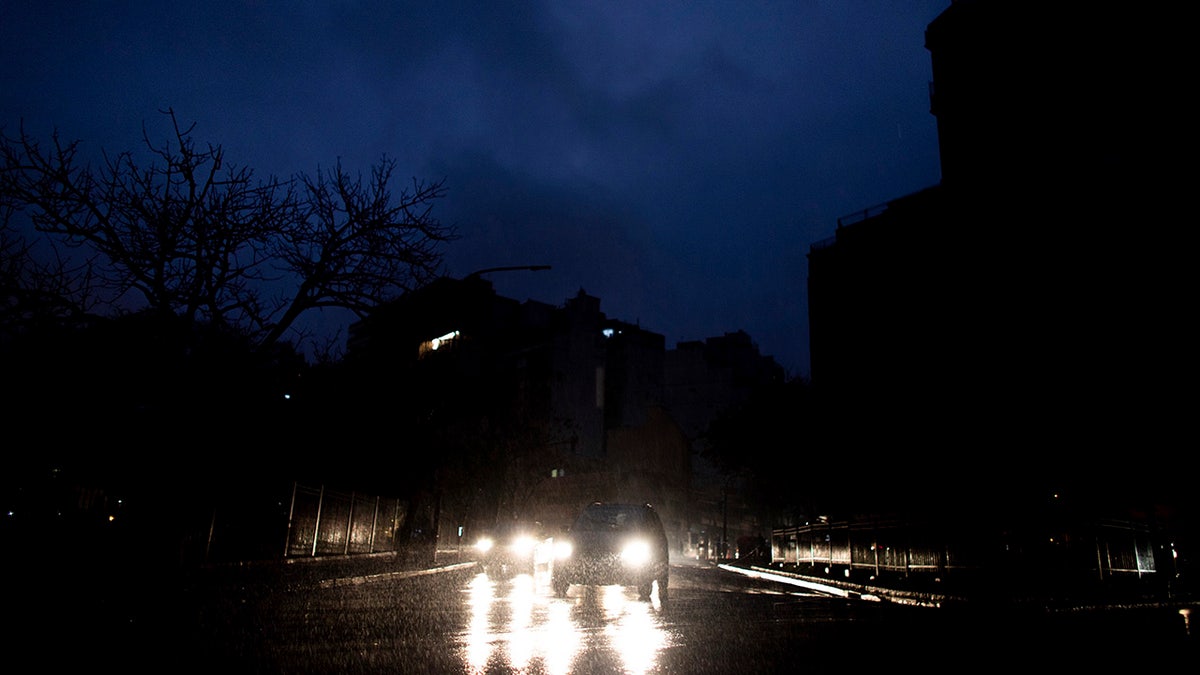 Cars drive through an unlit street during a blackout in Buenos Aires, Argentina, Sunday, June. 16, 2019. A massive blackout left tens of millions of people without electricity in Argentina, Uruguay and Paraguay on Sunday in what the Argentine president called an “unprecedented” failure in the countries’ power grid. (AP Photo/Tomas F. Cuesta)