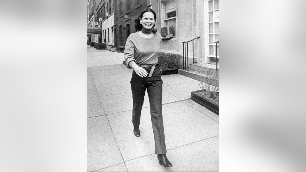 FILE- In this undated file photo heiress and designer Gloria Vanderbilt walks down a New York street. Vanderbilt died on Monday, June 17, 2019, at 95, according to her son, CNN anchor Anderson Cooper. (New York Post via AP, File)