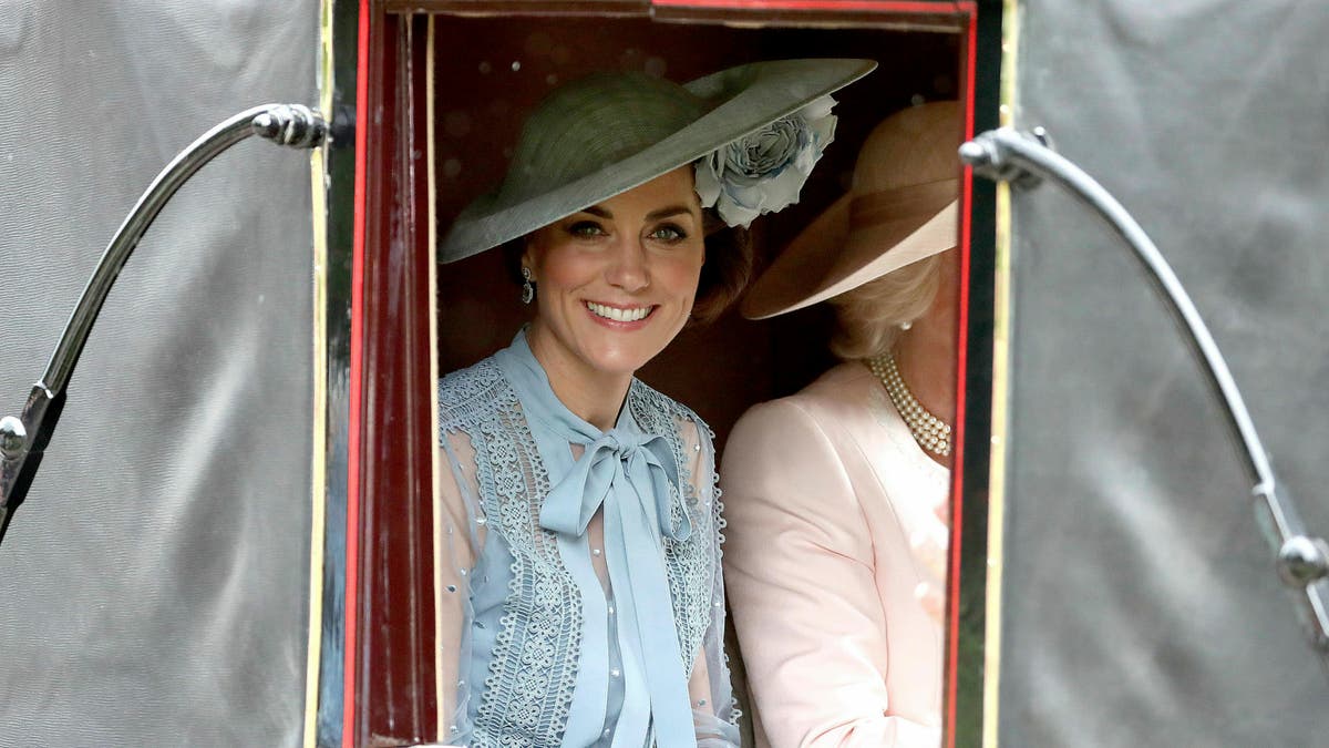 Britain's Kate, Duchess of Cambridge looks out from a carriage in Windsor Great Park on her way to Royal Ascot horse race meeting in Ascot, England, Tuesday, June 18, 2019. (Steve Parsons/PA via AP)