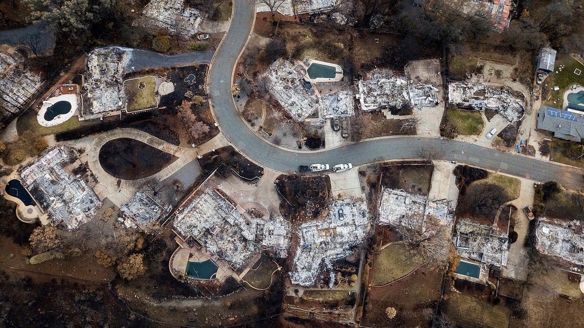 This Dec. 3, 2018, file photo, shows homes leveled by the Camp Fire line Valley Ridge Drive in Paradise, Calif. (AP Photo/Noah Berger, File)