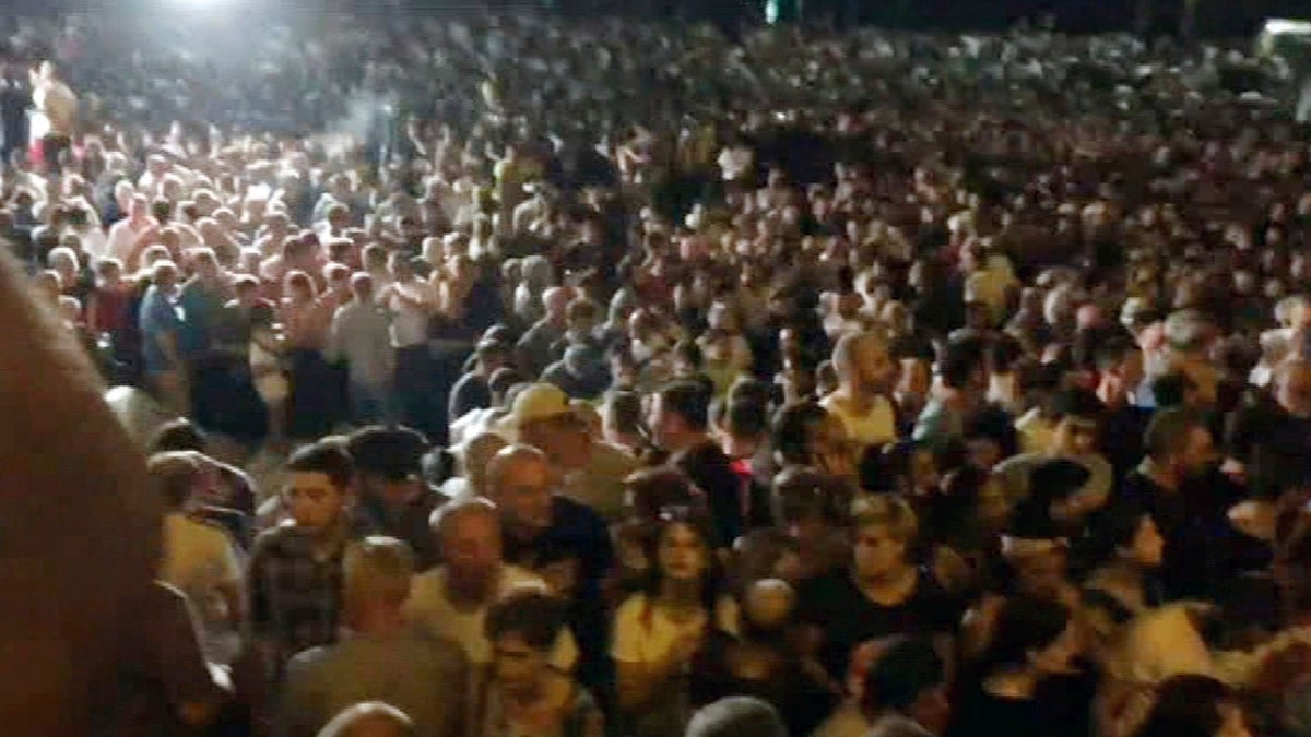 In this image from video, thousands of protesters gather outside the Parliament in Tbilisi on Thursday. (AP Photo)
