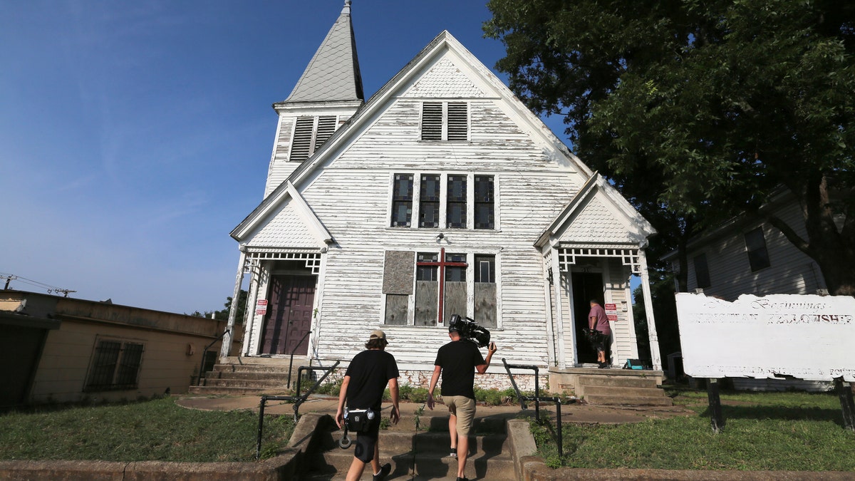 A film crew arrives at an old historic church that will be relocated and renovated to be the the new Magnolia Coffee Shop and furniture showroom, part of a $10.4 million expansion of Magnolia Market at the Silos. (Rod Aydelotte/Waco Tribune-Herald via AP)