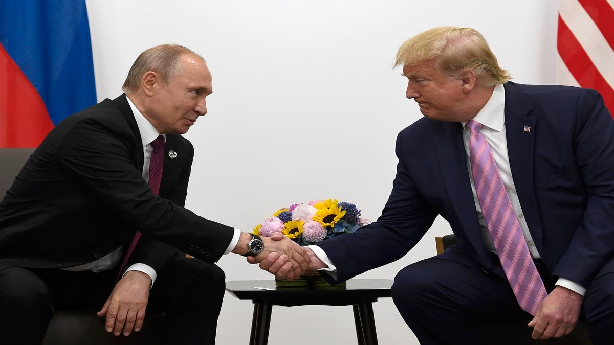 President Donald Trump, right, shakes hands with Russian President Vladimir Putin during a bilateral meeting on the sidelines of the G-20 summit in Osaka, Japan, Friday, June 28, 2019