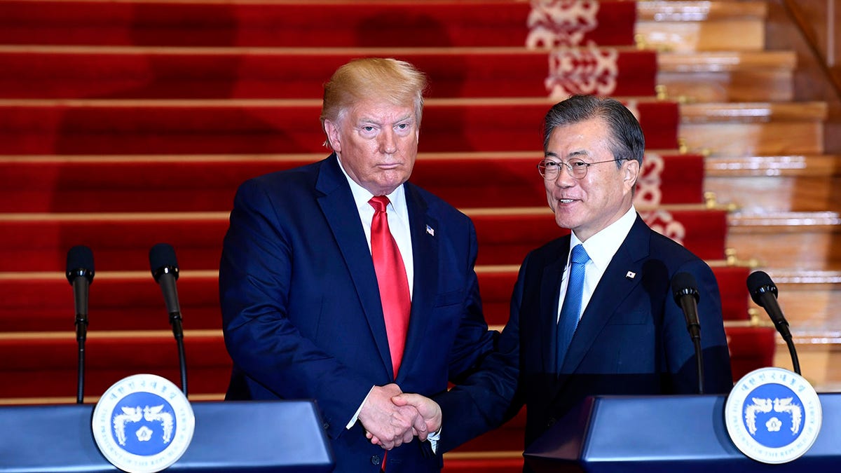 President Donald Trump, left, and South Korean President Moon Jae-in shake hands following their news conference at the Blue House in Seoul, Sunday, June 30, 2019. (Associated Press)