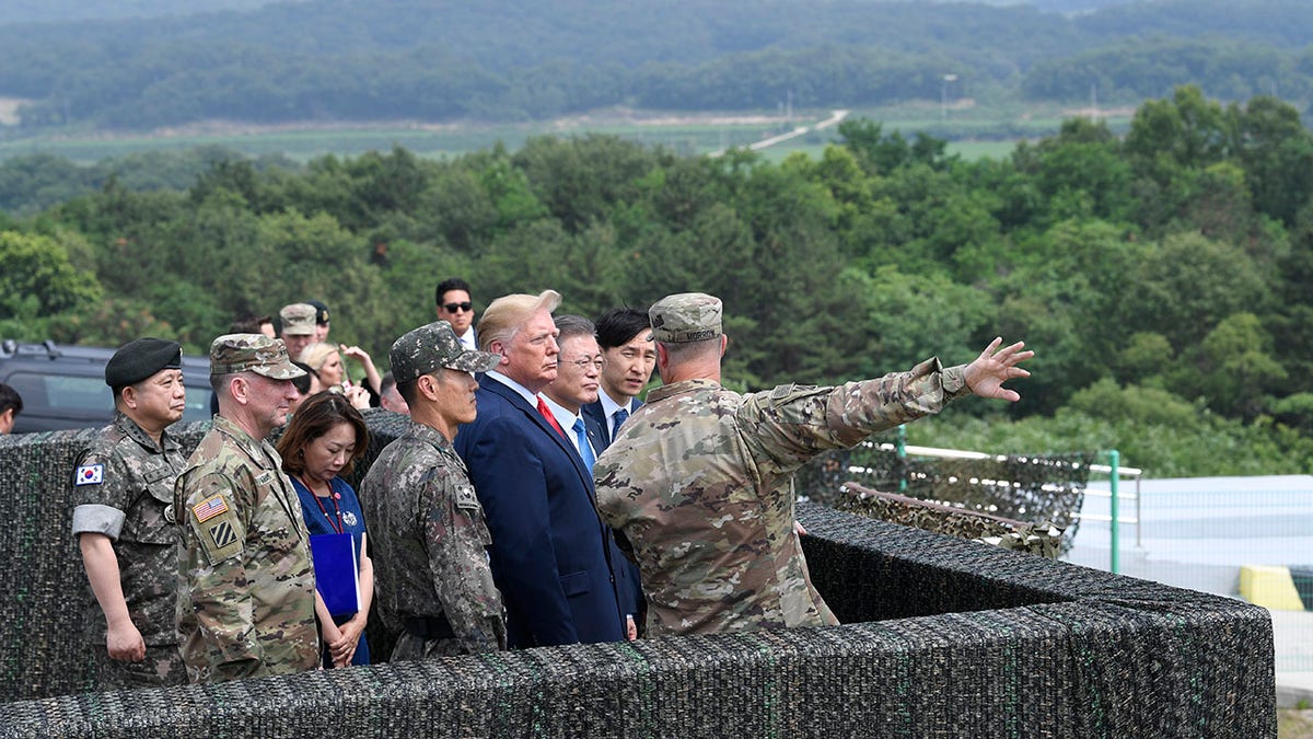President Donald Trump views North Korea from the Korean Demilitarized Zone from Observation Post Ouellette at Camp Bonifas in South Korea, Sunday, June 30, 2019. (Associated Press)