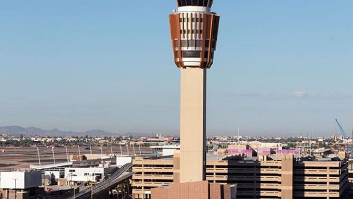 A man was arrested Tuesday after allegedly rushing a security checkpoint at the Phoenix Sky Harbor International Airport and injuring Transportation Security Administration officers. 