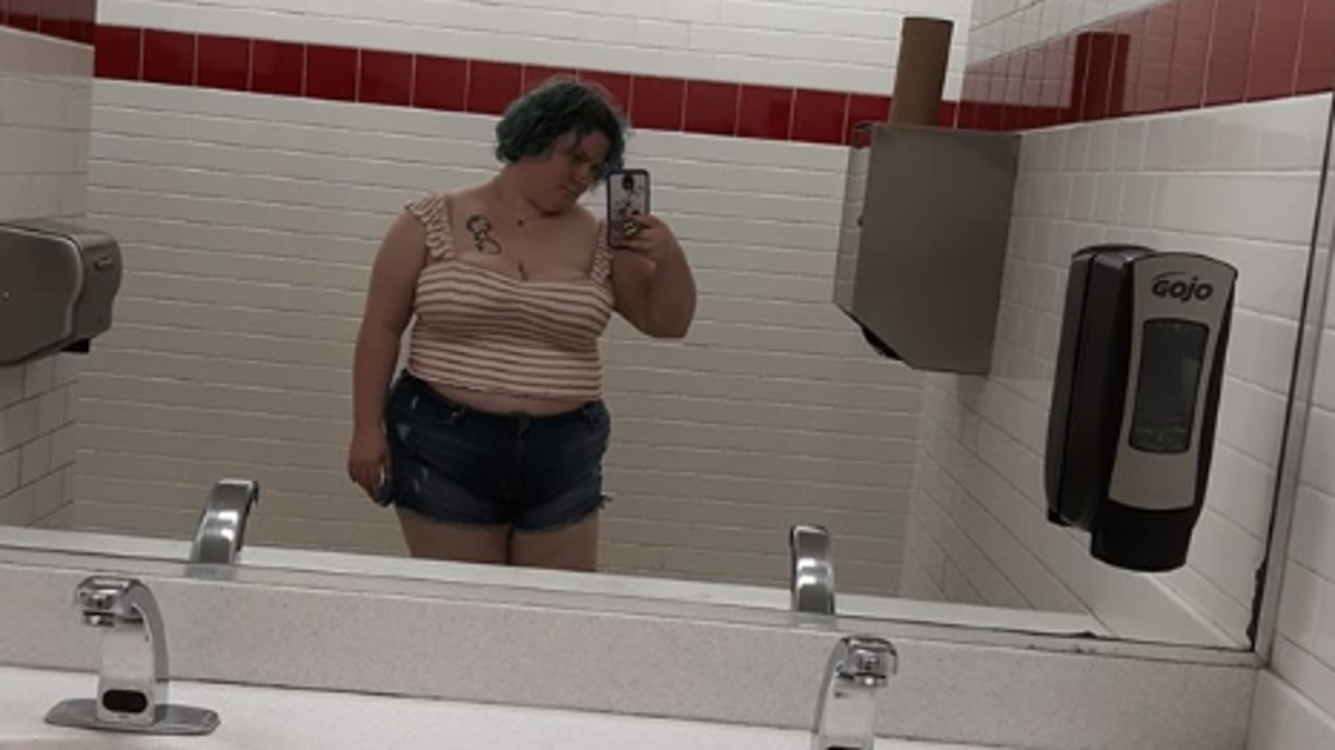 Sueretta Emke, pictured, claimed in a Facebook post that a Golden Corral restaurant manager kicked her out because her crop top was too provocative. 