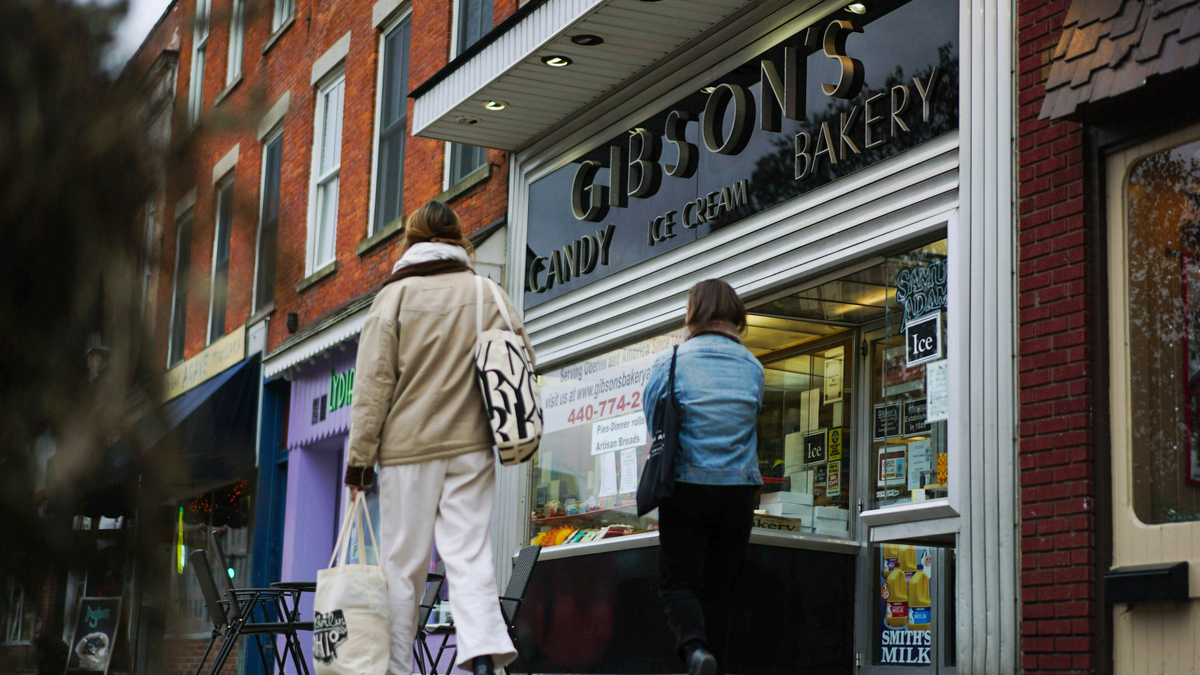 People walking near Gibson's Bakery storefront in Oberlin, Ohio