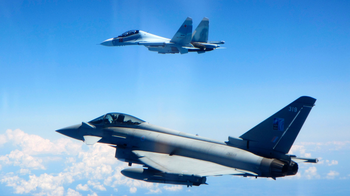 CAPTION CORRECTS AIRCRAFT NAME - In this photo taken on Saturday, June 15, 2019, a Royal Air Force Typhoon jet, bottom, flies by a Su-30 Flanker fighter. Two Royal Air Force jets deployed in Estonia have been scrambled twice in recent days, bringing the number of intercepts of Russian aircraft to eight since taking over the Baltic Air Policing mission in early May. The Typhoon jets were alerted Friday to intercept a Russian Su-30 Flanker fighter, and passed a military transport craft as it was escorting the fighter over the Baltic Sea. In a second incident on Saturday, RAF crews intercepted a Su-30 Flanker fighter and an Ilyushin Il-76 Candid transport aircraft that was traveling north from the Russian enclave of Kaliningrad toward Estonian and Finnish airspace. (UK Ministry of Defence via AP)