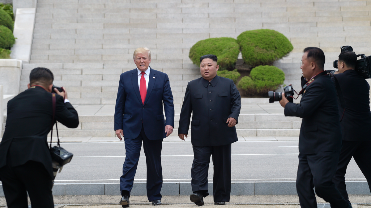 President Donald Trump and North Korean leader Kim Jong Un walk on the North Korean side at the border village of Panmunjom in the Demilitarized Zone, Sunday, June 30, 2019. (AP Photo/Susan Walsh)