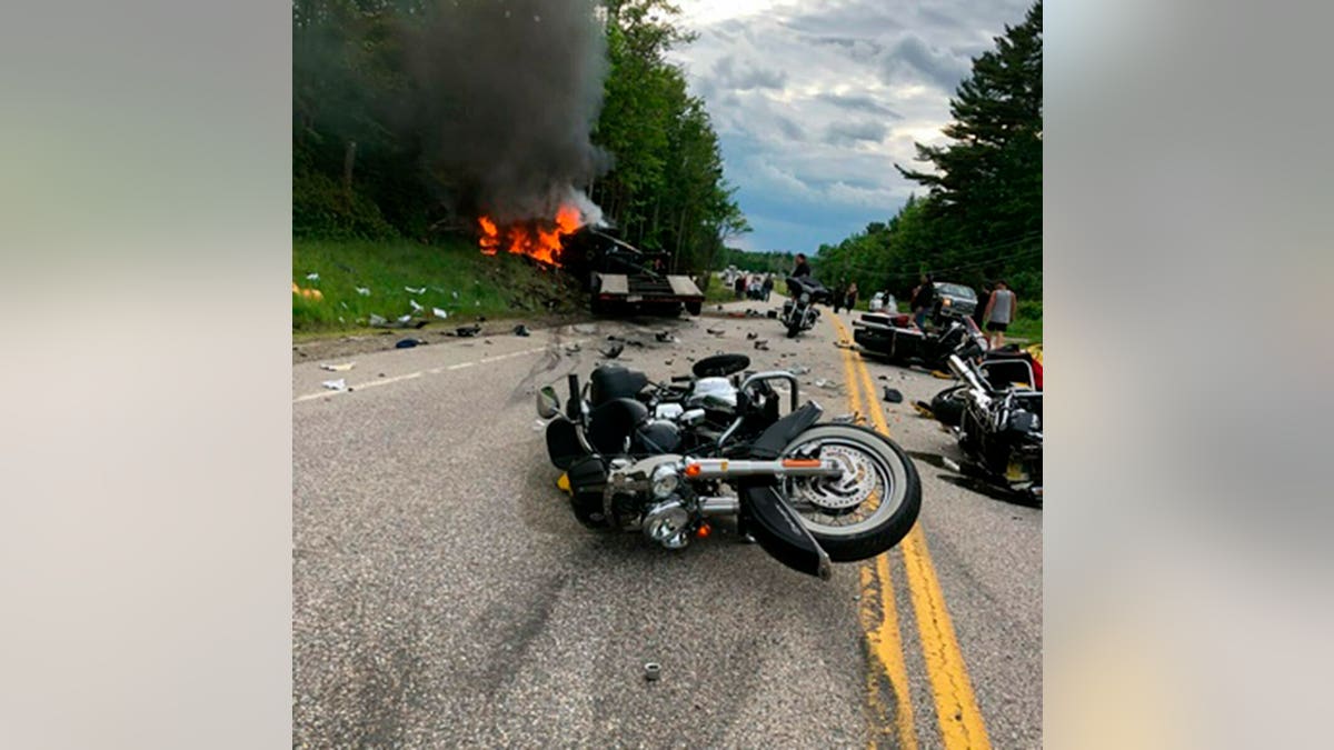 This photo provided by Miranda Thompson shows the scene where several motorcycles and a pickup truck collided on a rural, two-lane highway Friday, June 21, 2019 in Randolph, N.H. (Associated Press)