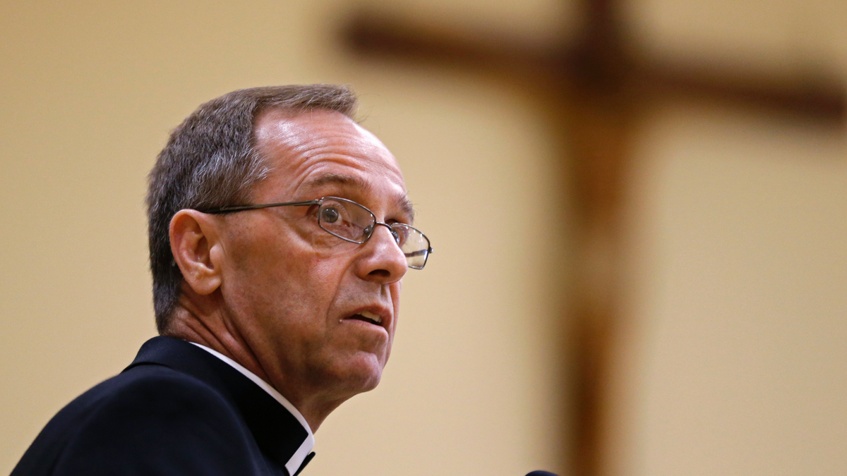 Bishop Charles Thompson speaks after he is introduced as the new archbishop of Indianapolis in Indianapolis in June 2017. The Archdiocese of Indianapolis says it no longer will recognize a Jesuit high school as Catholic because it refuses to fire a teacher who's in a same-sex marriage.